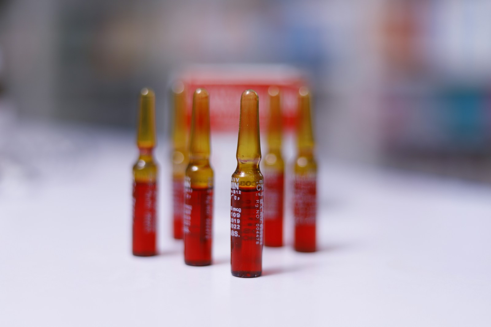 a group of red and yellow bottles sitting on top of a table